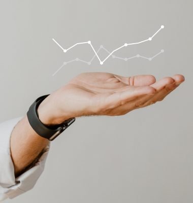 Digital graph performance with businessman hand overlay